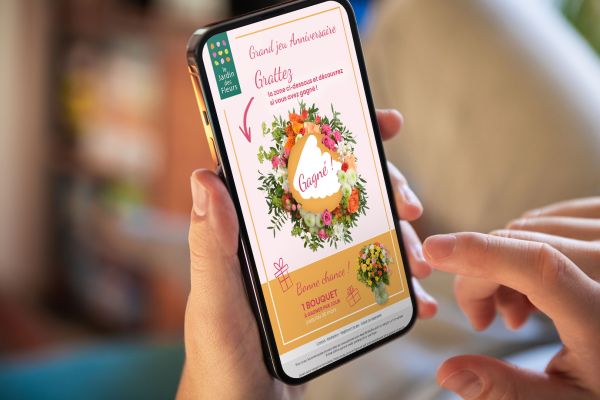 Ticket à gratter digital sur mobile pour Jardin des fleurs, image utilisée pour illustrer l'article Article "organiser un jeu concours en ligne" de l'agence colombo, expert en création de jeux marketing